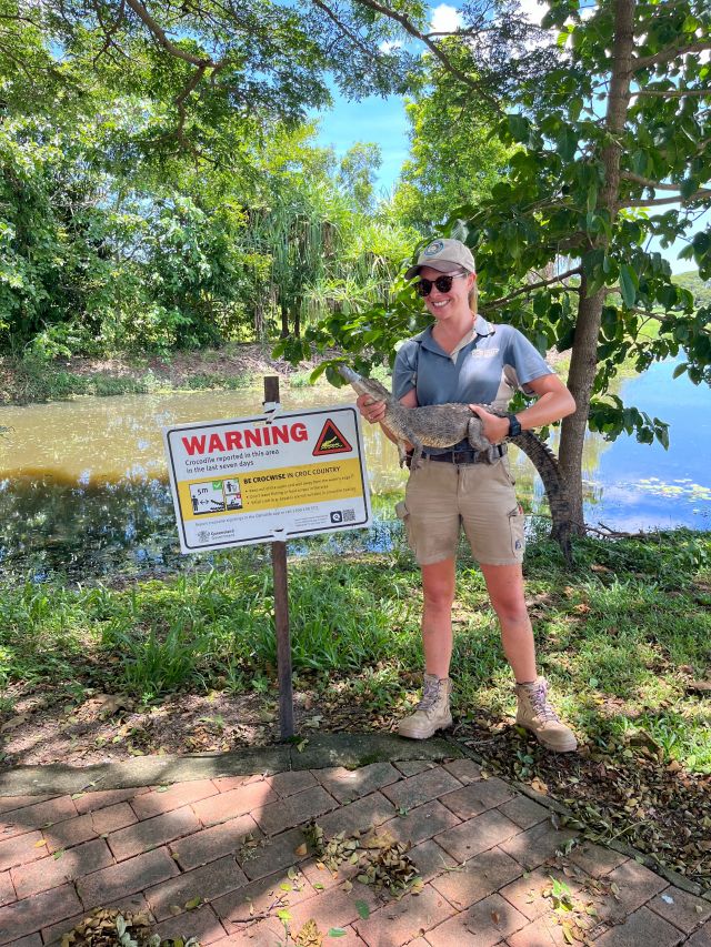 Photo of Wildlife Officer Ella Meeve holding the removed crocodile