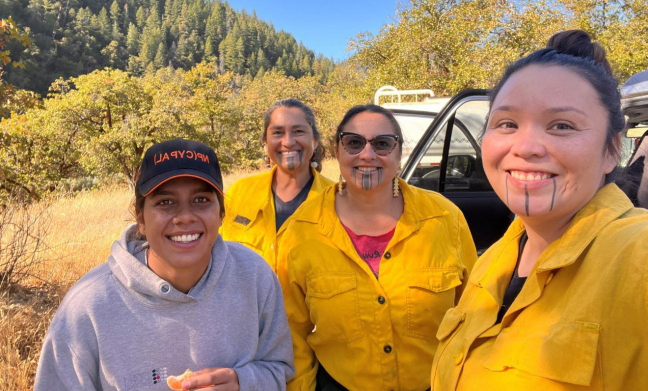 Photo of rangers Alex, Missy, Annelia, Sammi who were all smiles for cultural burning on Karuk country.