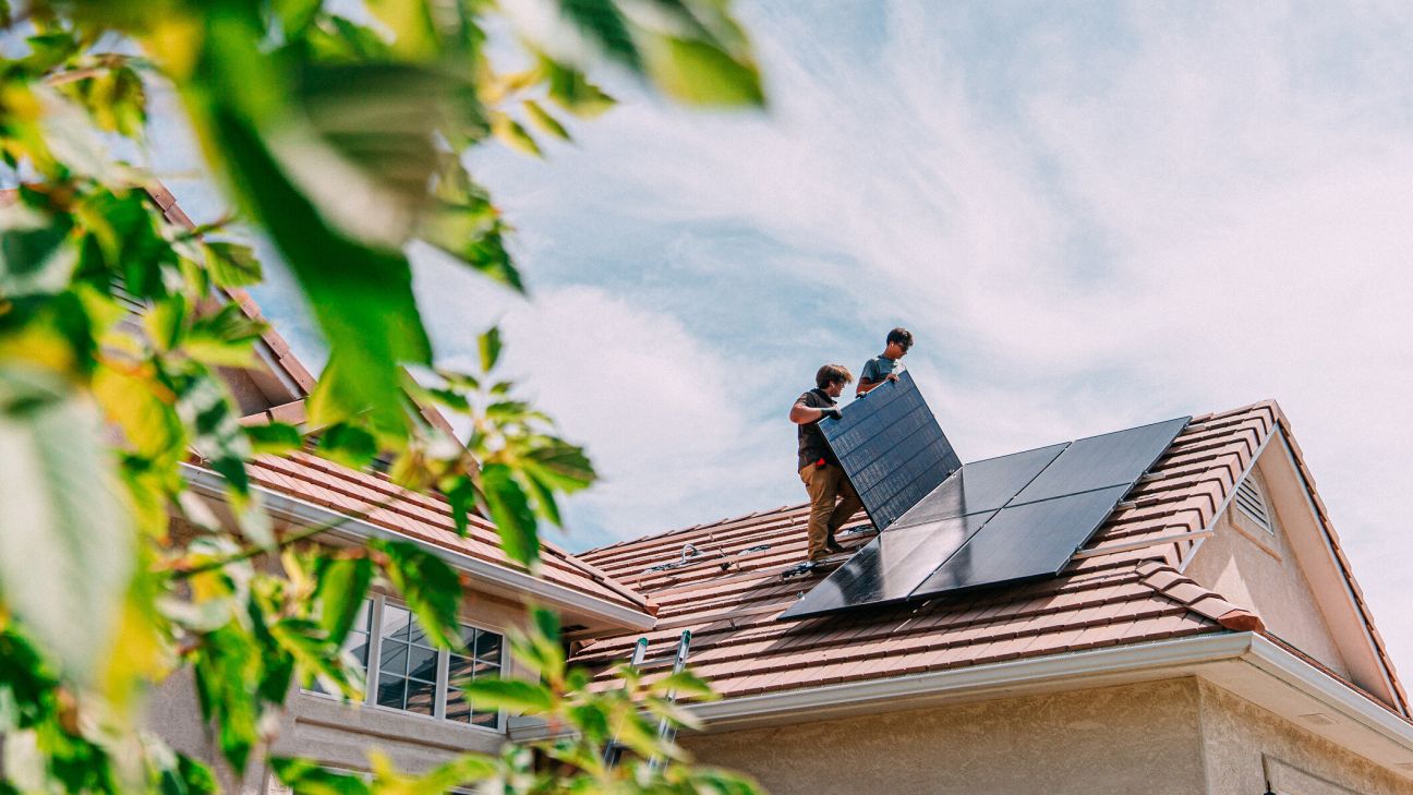 Solar panels installed on a residential rooftop generating renewable energy.