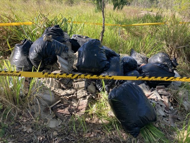QPWS is investigating after the rubbish was recently discovered.